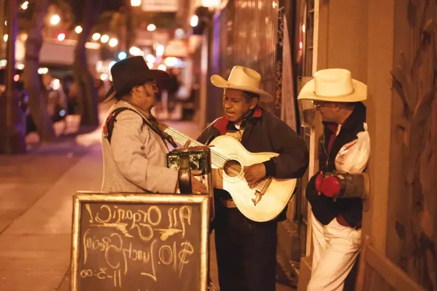 Three Mexican musicians perform on a street in 教会区 of San Francisco.